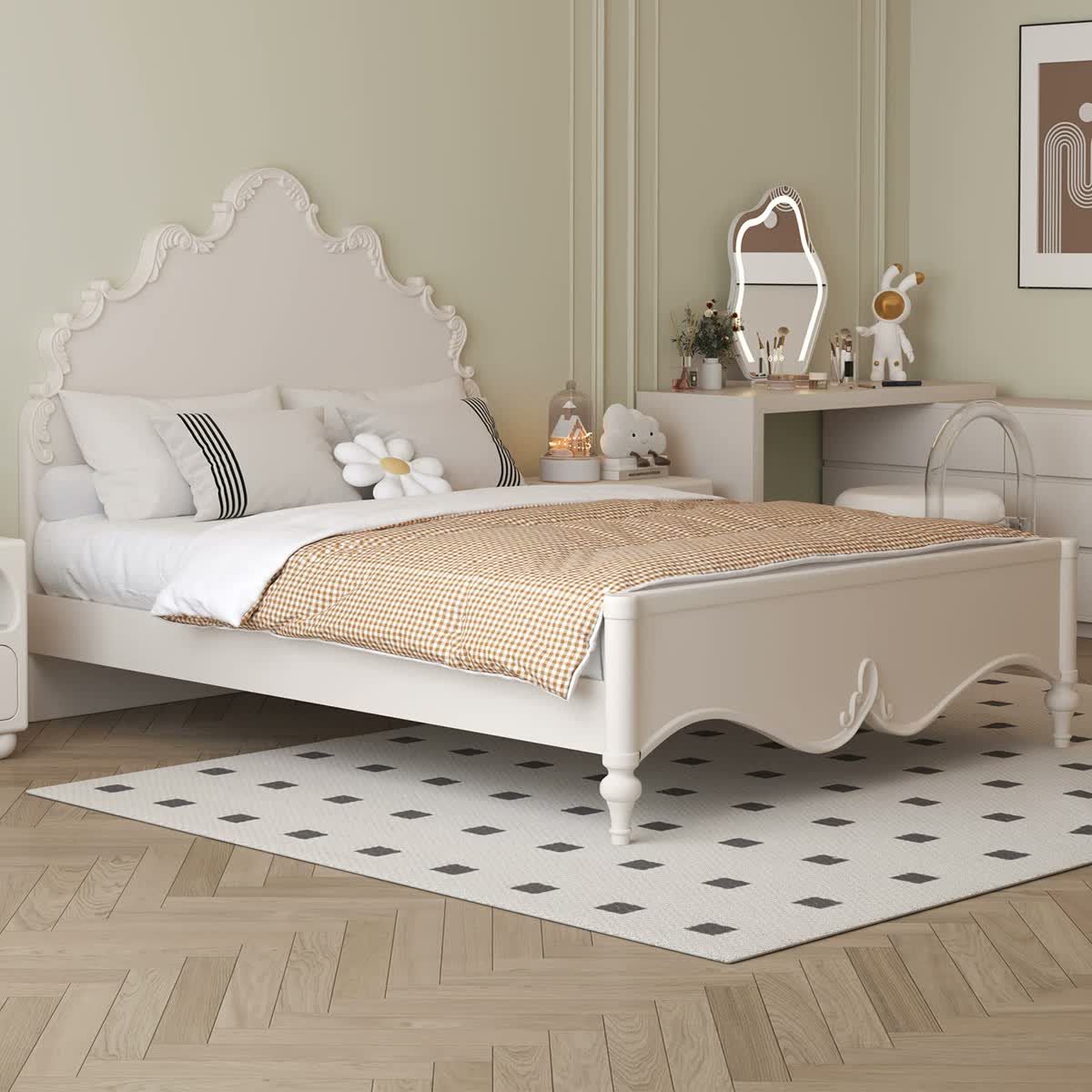 Cream-white carved wave bed with a raised footboard and turned wood legs.