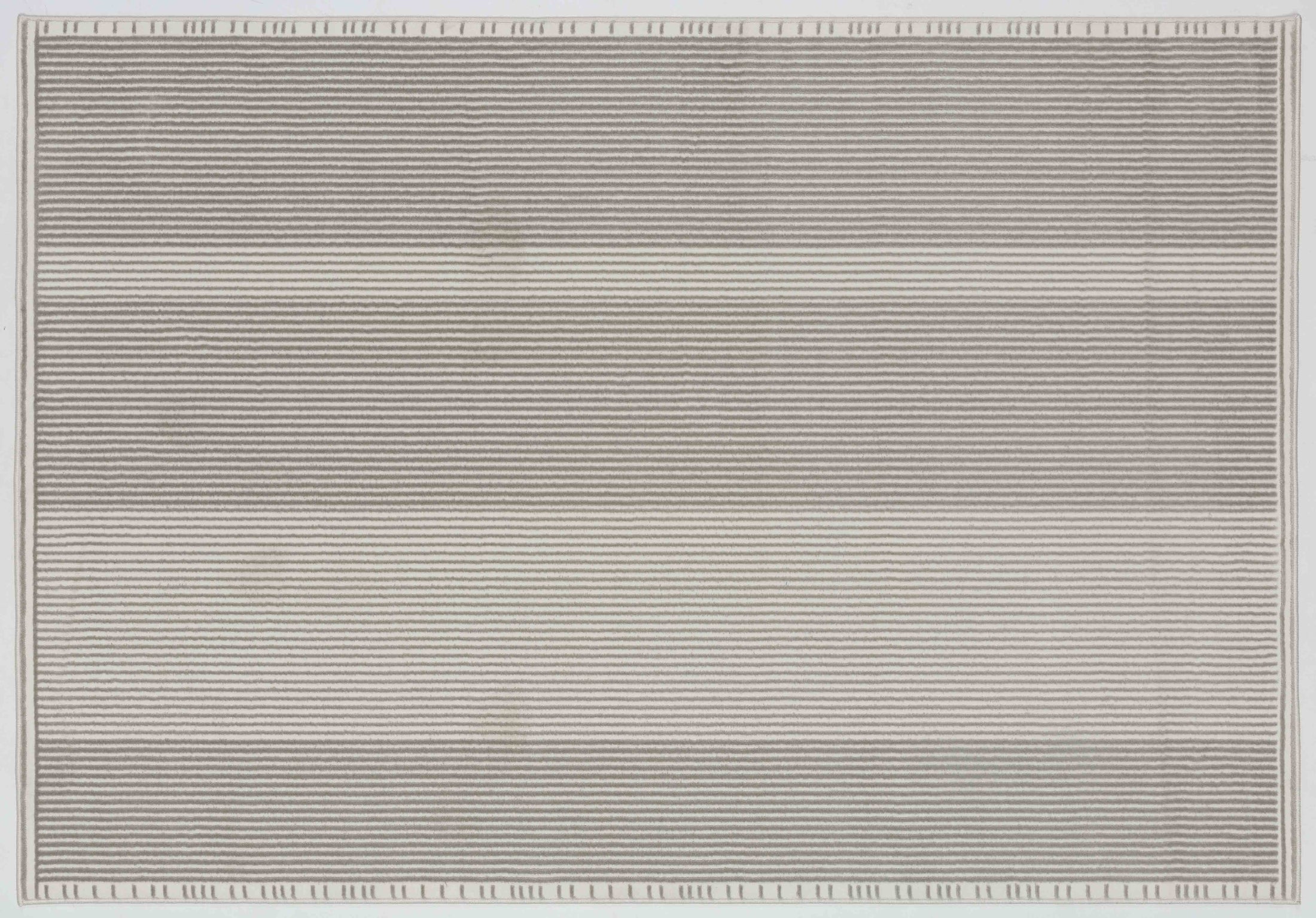 Whisper Dawn Area Rug in a finished interior.