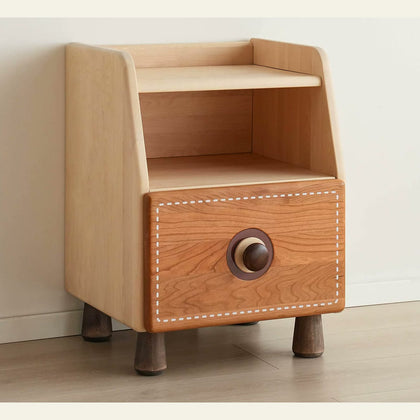  Birch bedside cabinet with cherry wood drawer, round knob, open shelf and tapered feet.