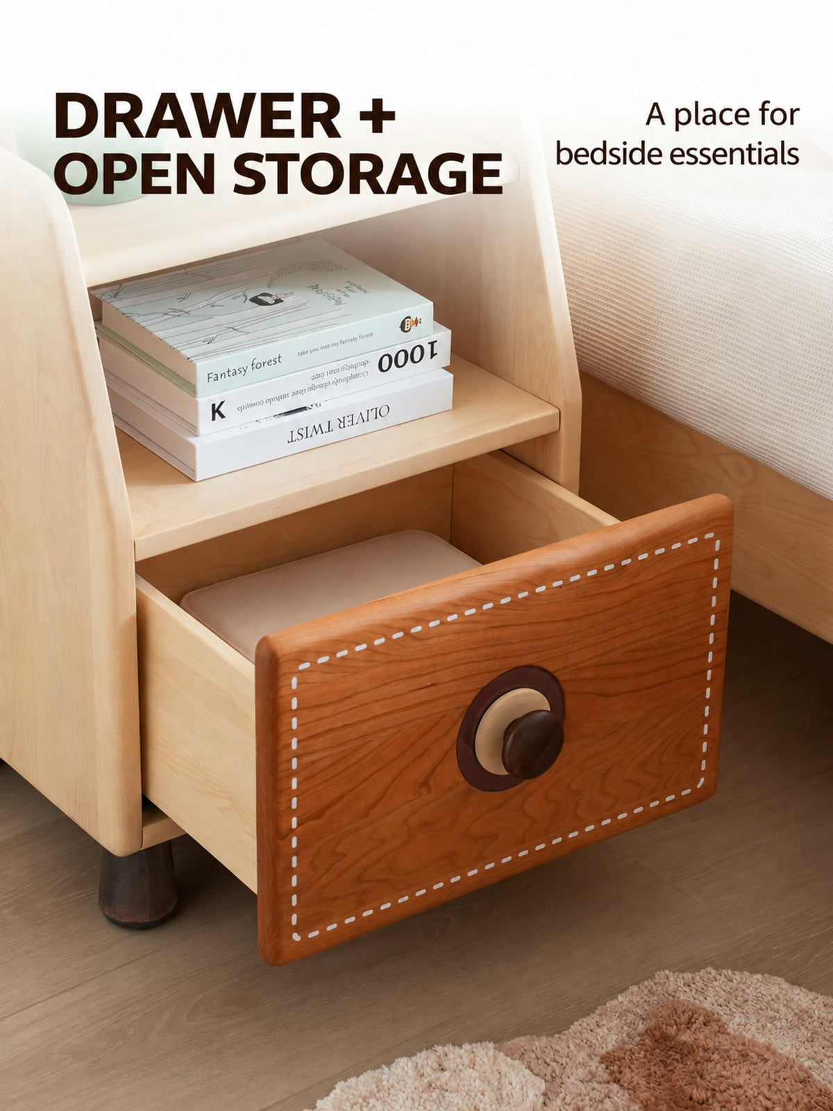  Open lower drawer beneath a shelf holding books.
