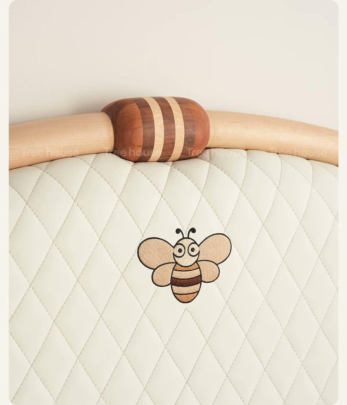  Bee motif and diamond quilting on the arched headboard