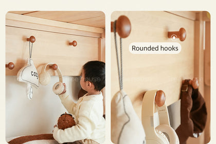  Rounded wooden hooks below the upper bed