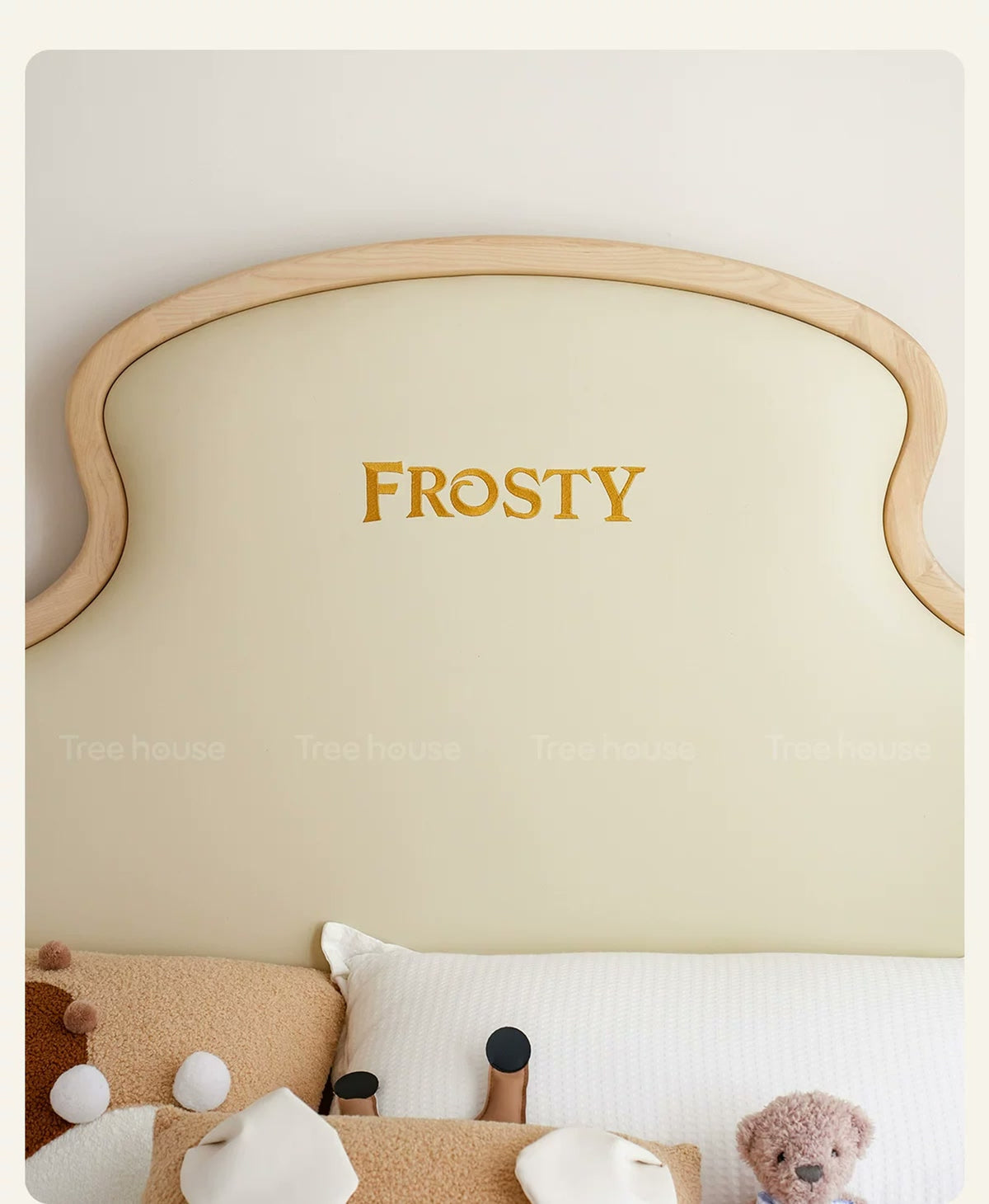  FROSTY embroidery on the cream headboard upholstery.