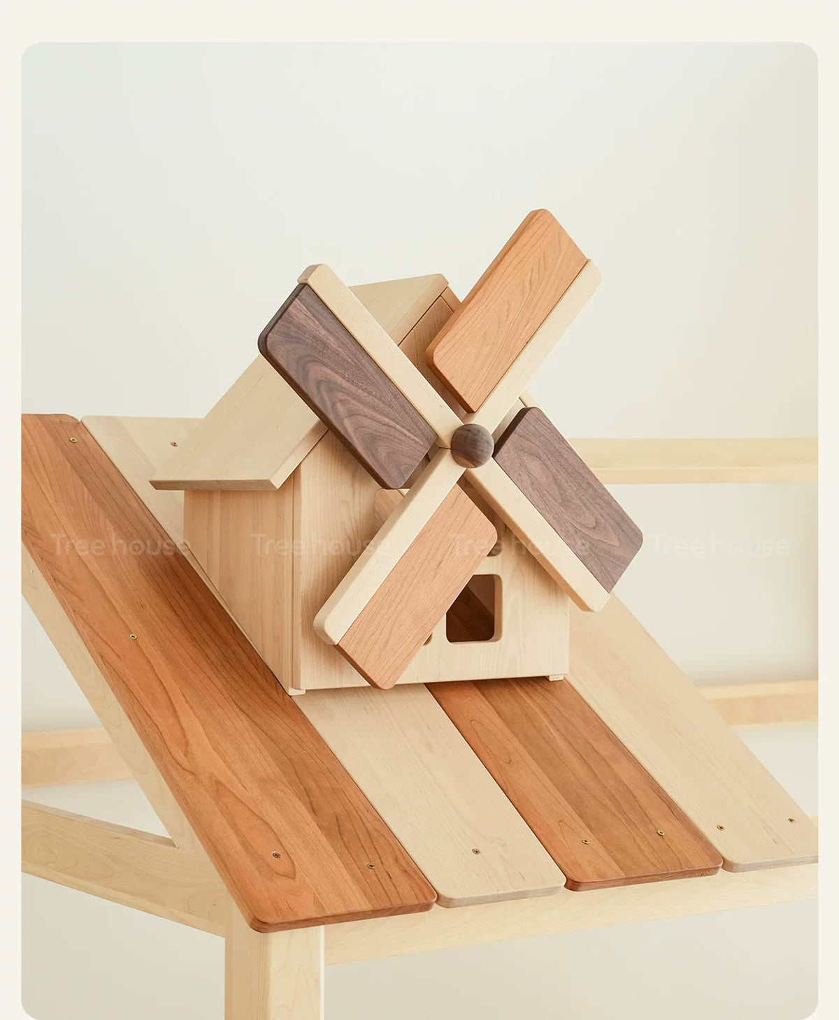  Decorative turning wooden windmill on the cottage roof.