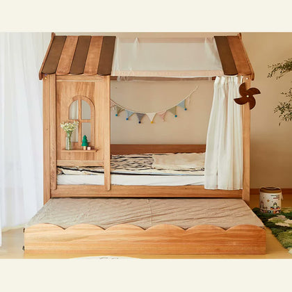  Wood house bed shown with optional curtains and extended trundle.