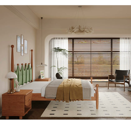  Side profile of the wood bed with green upholstered headboard.