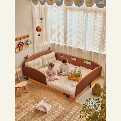  Cow-inspired brown upholstered bed in its low arrangement with side panels.
