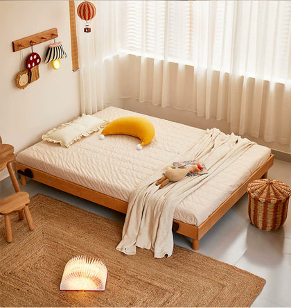  Wood bed base without headboard and side panels, shown with mattress.