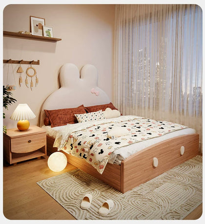 Front three-quarter view of the bunny bed with curved wood footboard.