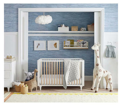  Room scene showing the giraffe basket beside a crib for visual scale.