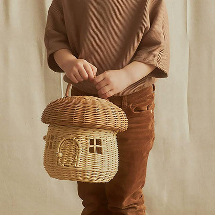  Mushroom basket carried by its handle, showing visual scale.