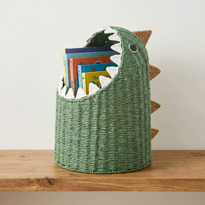  Books stored upright inside the dinosaur basket.