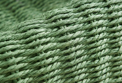  Close-up of green twisted paper rope woven into the basket.