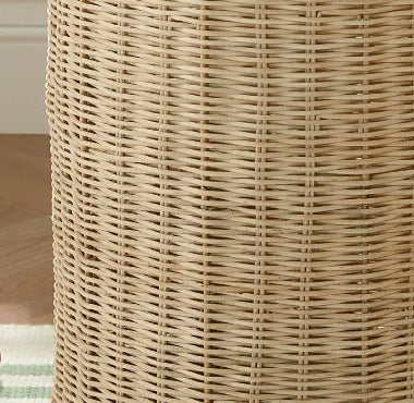  Close-up of the hamper's vertical woven rattan body.