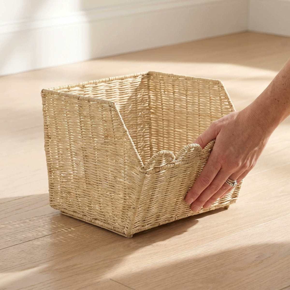  One empty basket showing its open top and sloped front.