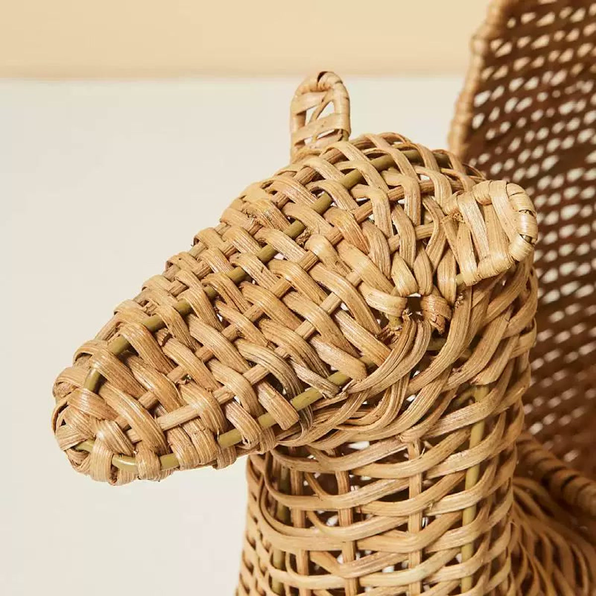  Close view of the camel's woven head and ears.