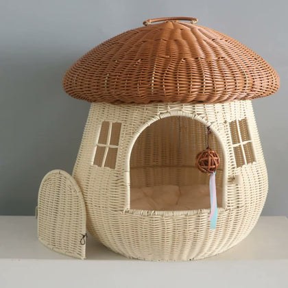  Camel-colored mushroom cat house with open arched door and woven cap.