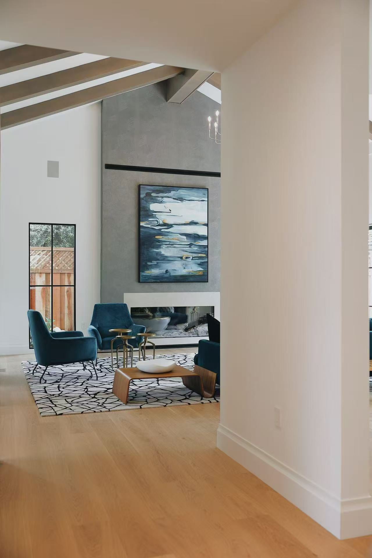 View from hallway into the living room and fireplace feature