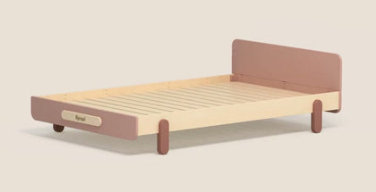  Cherry Pink children's bed with a raised headboard and fitted legs