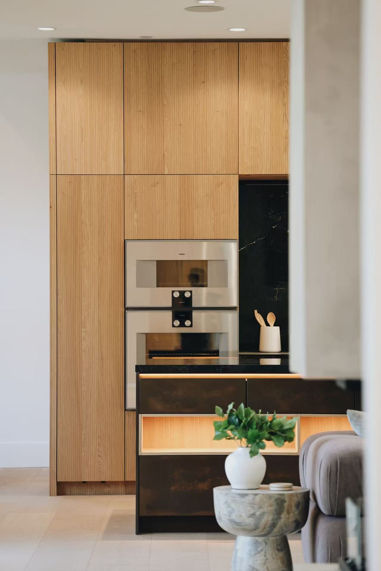 Kitchen appliance wall and living room seating detail