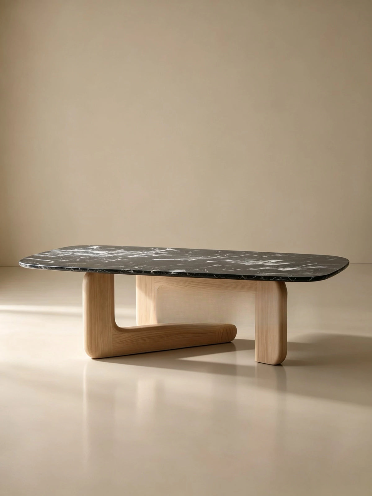 Black marble balanced by a light sculptural base.