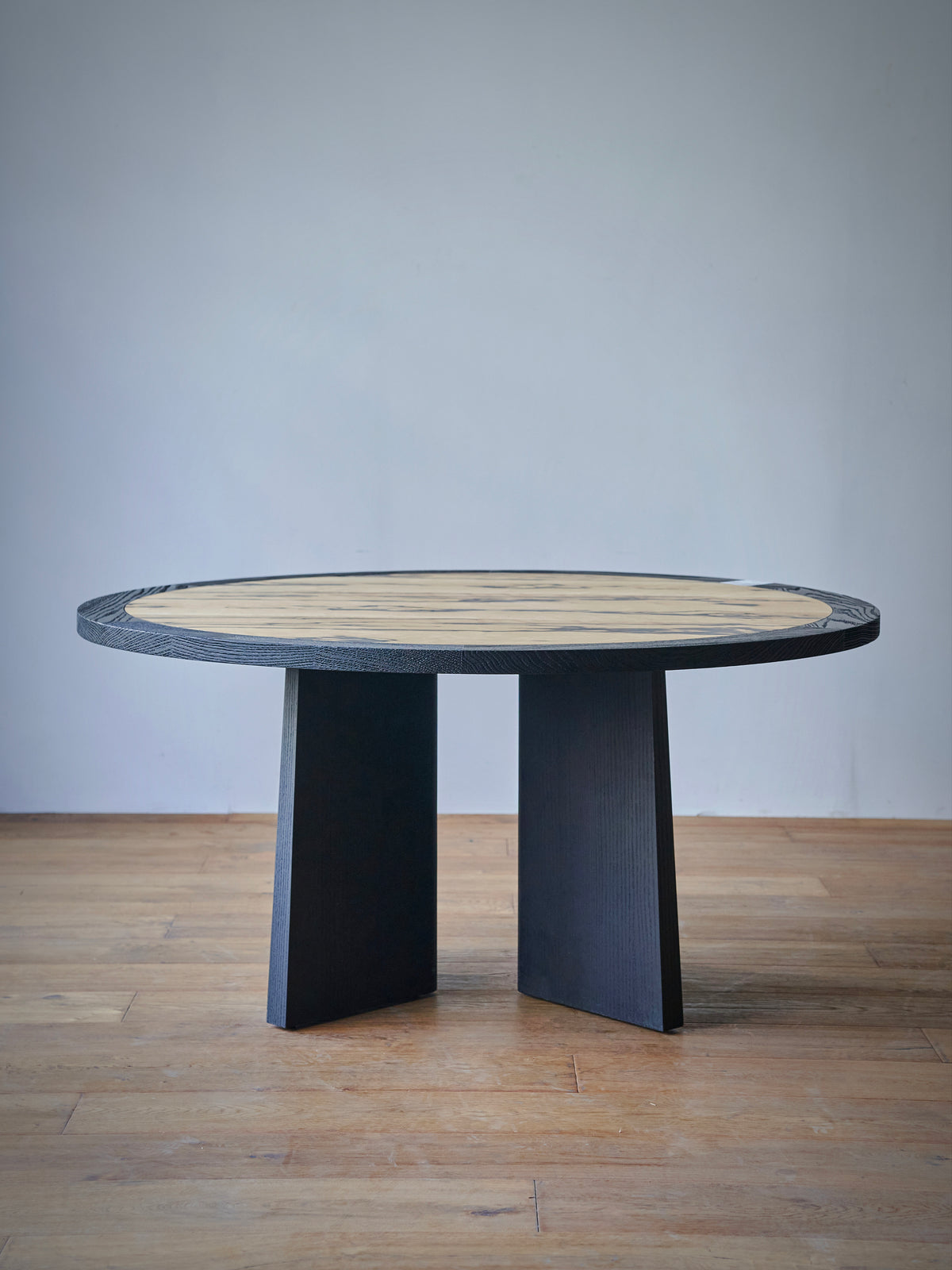 Elara Crest Dining Table in a finished interior.