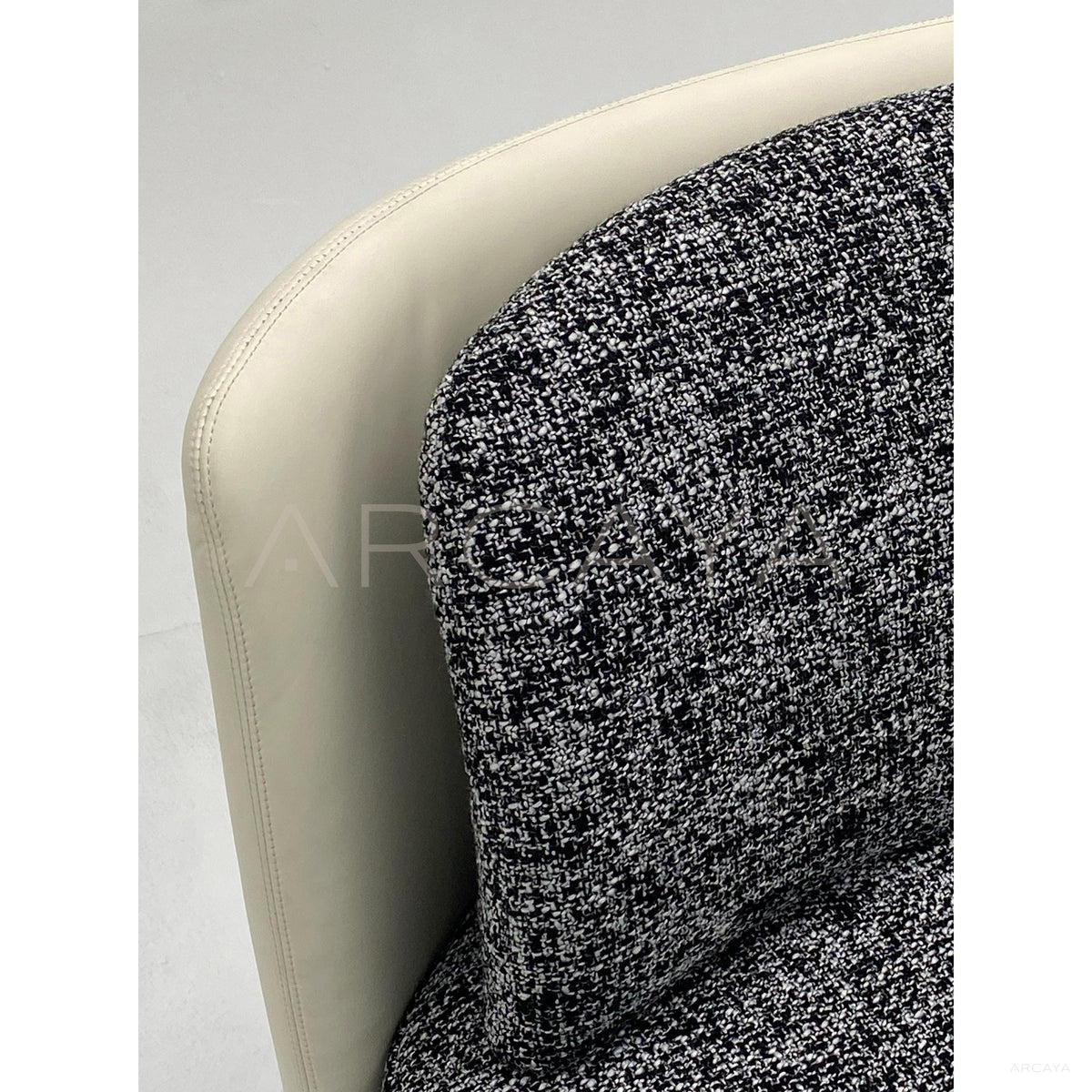 Tweed Leather Curved Stainless Leg Lounge Chair in detail