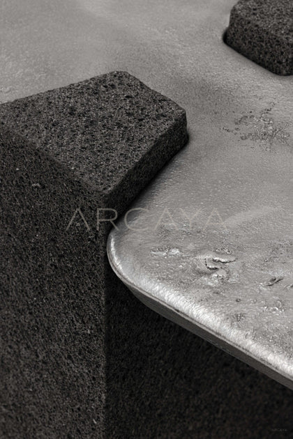 Exhuma Cast Metal Volcanic Stone Console Table - scene
