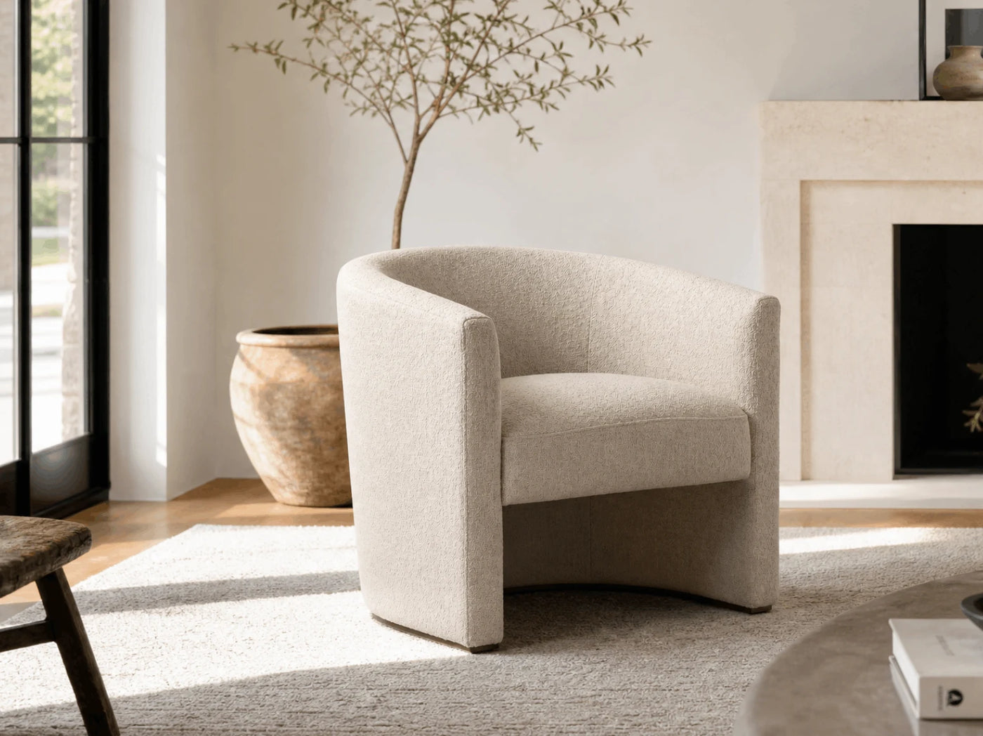 Boucle and leather lounge chairs