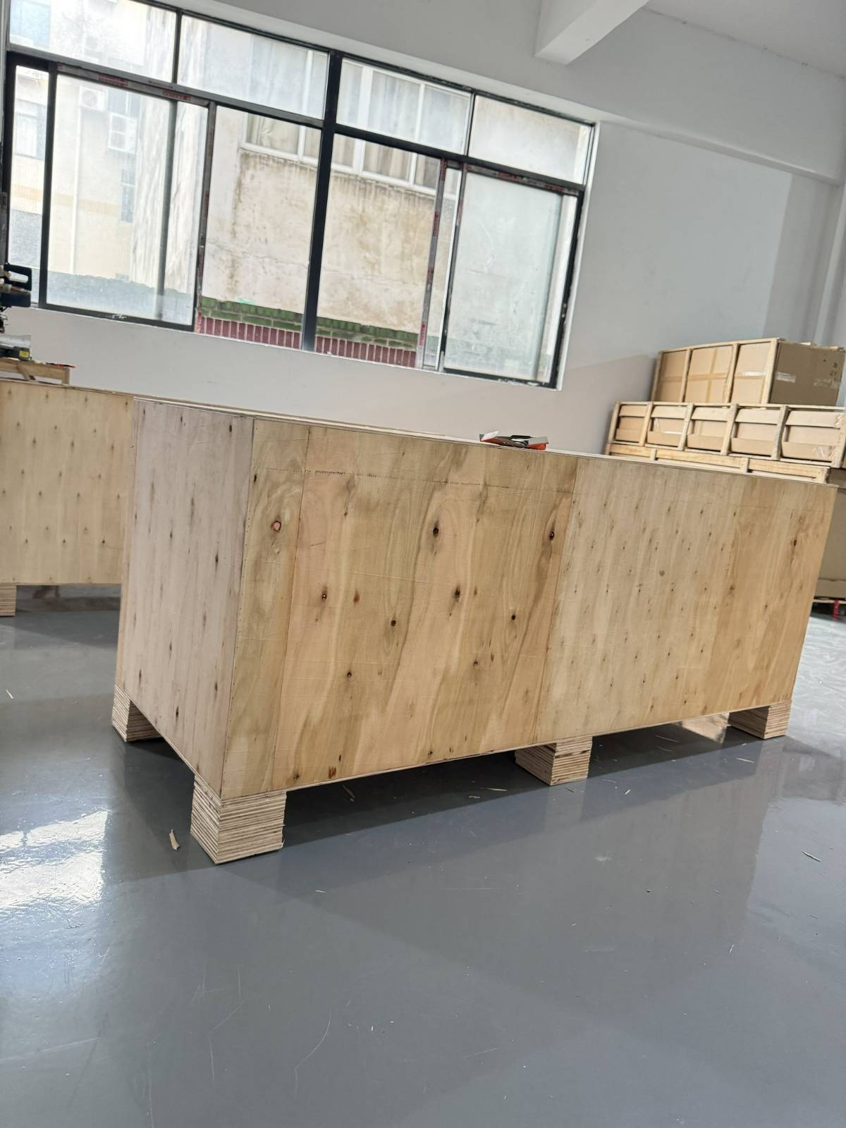 Corner of packed furniture crate checked before shipment