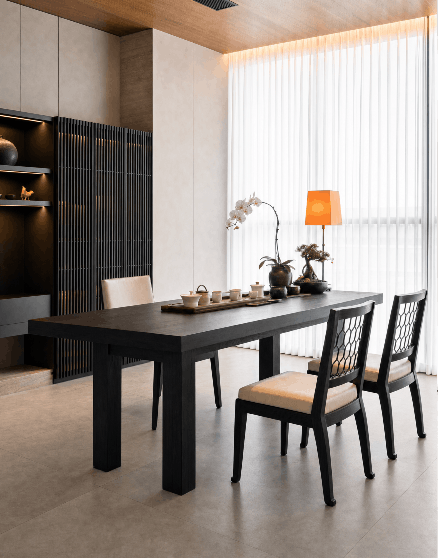 Dark wood dining table with natural textures and soft daylight