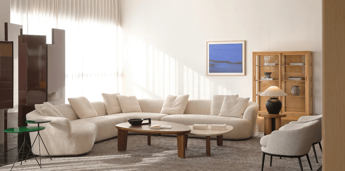 Sculptural curved sofa in an open living room