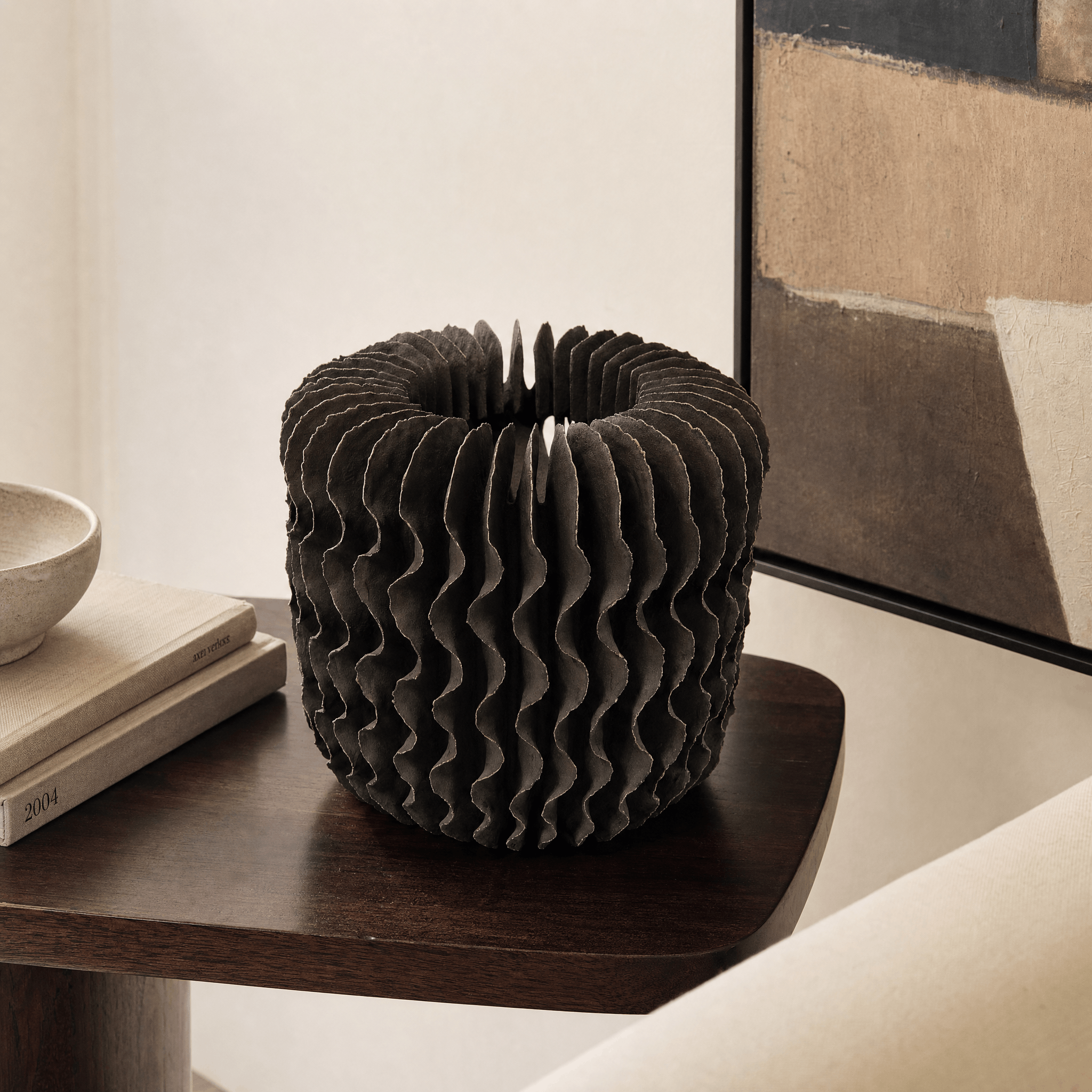 Dark Layered Wave Vessel in a finished interior.