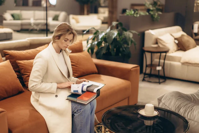 Designer reviewing material samples on a sofa