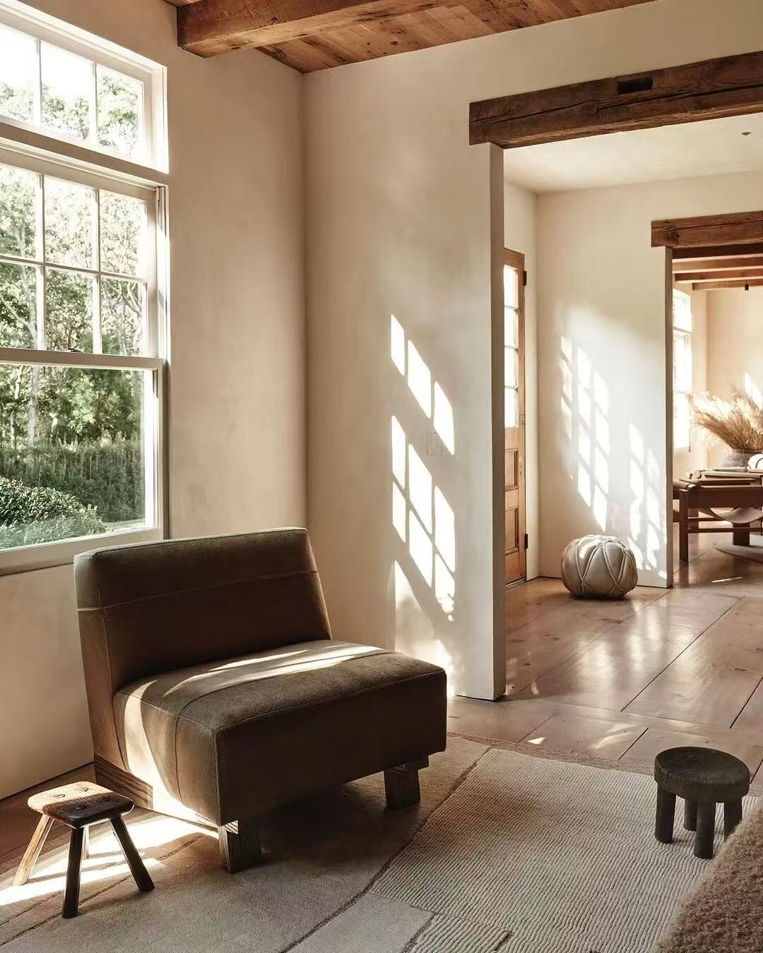 Living room with a curved sofa and soft forms