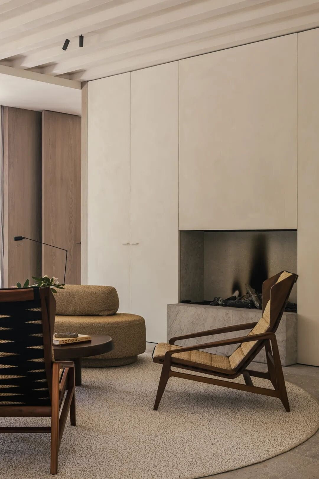 Accent chair beside a window with greenery