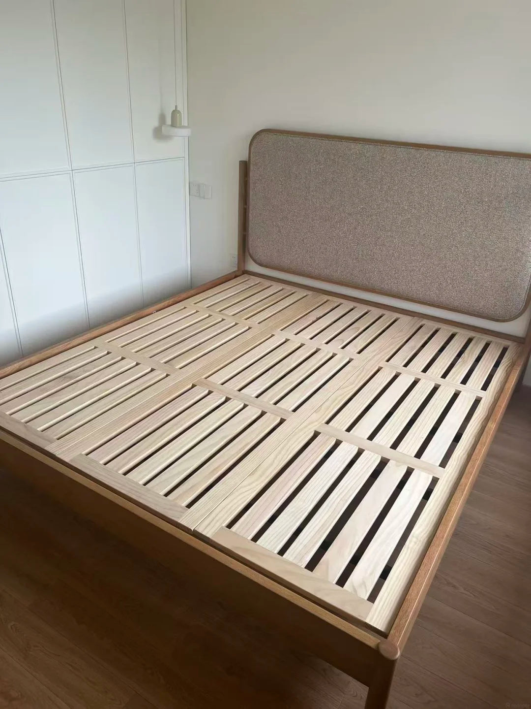 Closely spaced wood slats with sectional mattress support