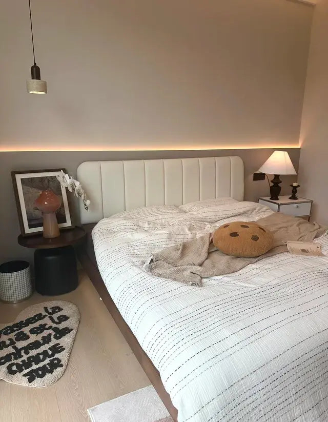 Vertical upholstered headboard in a warm bedroom setting