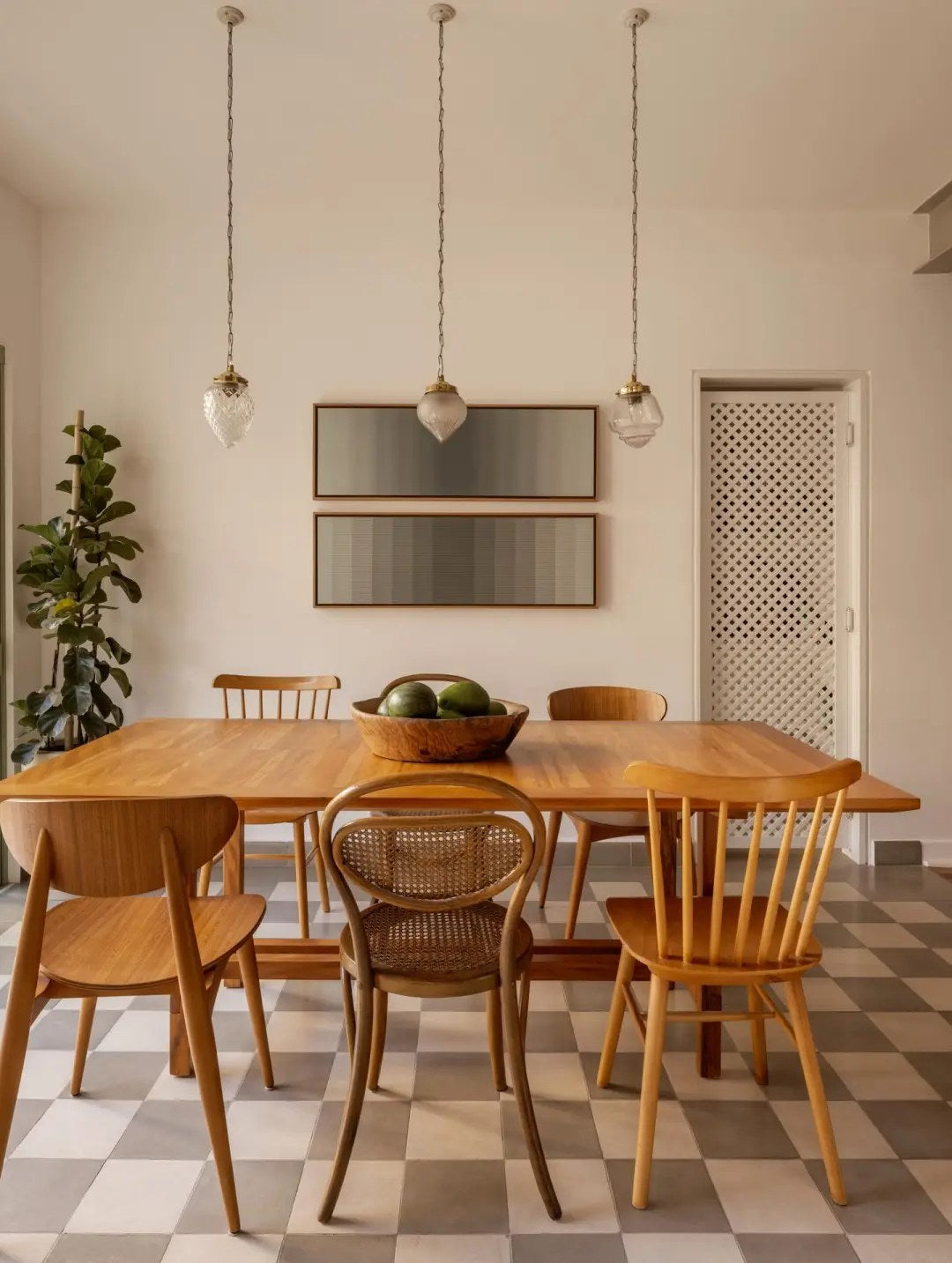 Repeat wood tones through chairs, shelves, and trim