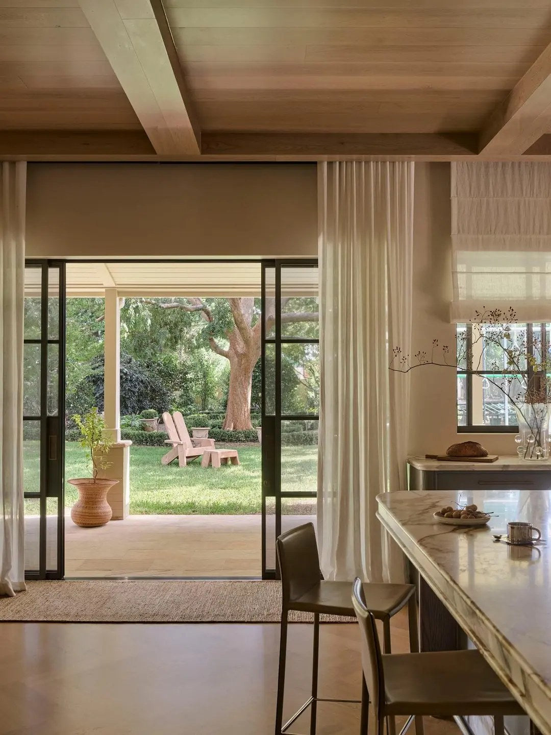 Keep window-facing cabinets calm and uncluttered