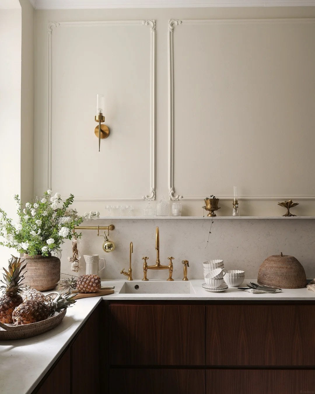 Warm wood and brass can make traditional details feel current