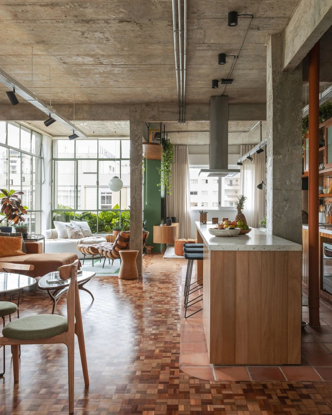 Pair industrial surfaces with warm timber cabinetry