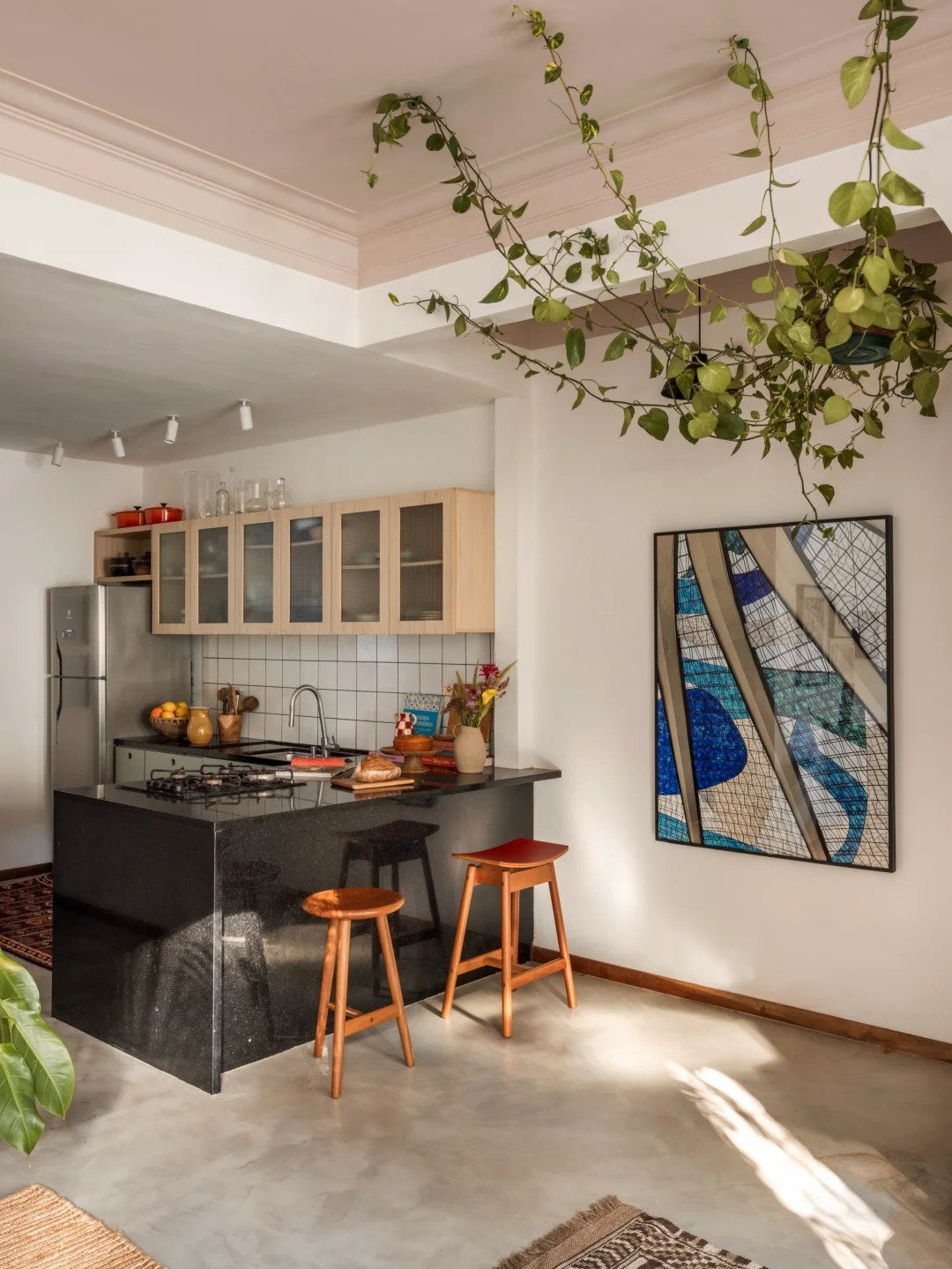 Glass-front uppers can lighten a colorful kitchen