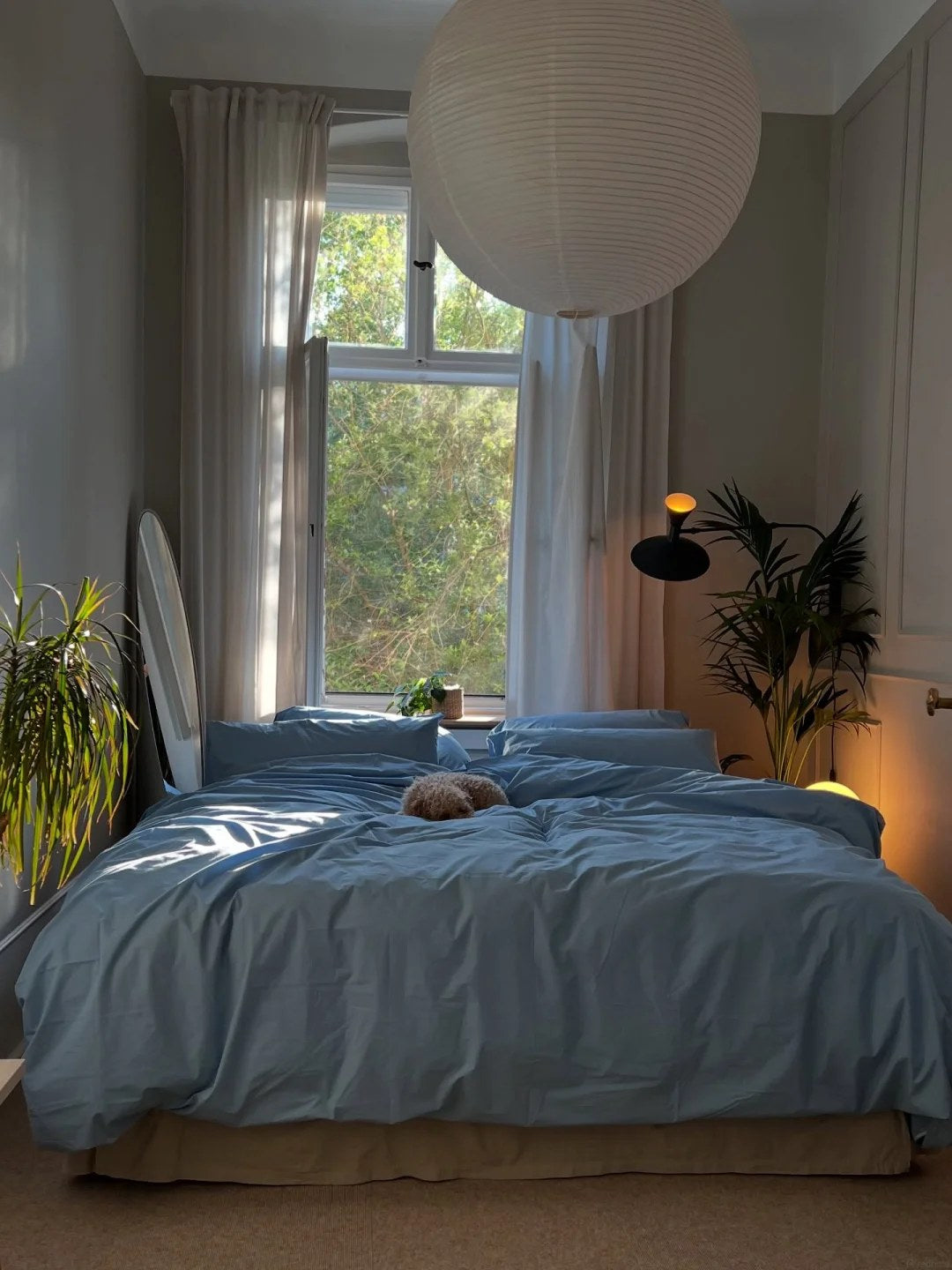 Keep the bed wall simple when storage sits nearby