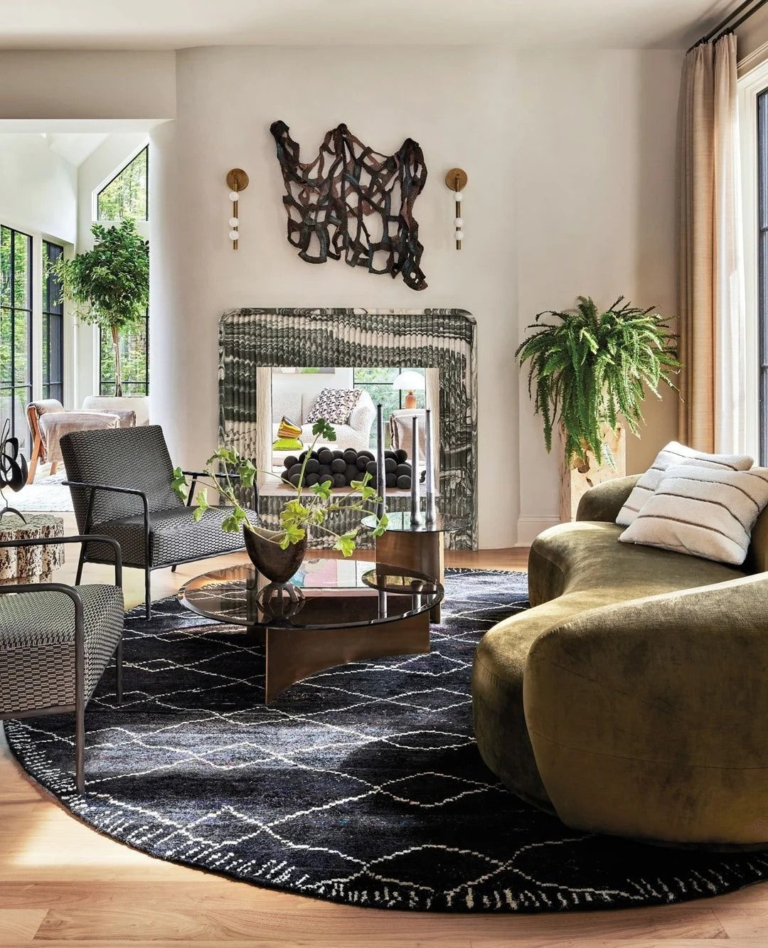 A darker rug and deeper upholstery keep an airy room grounded.