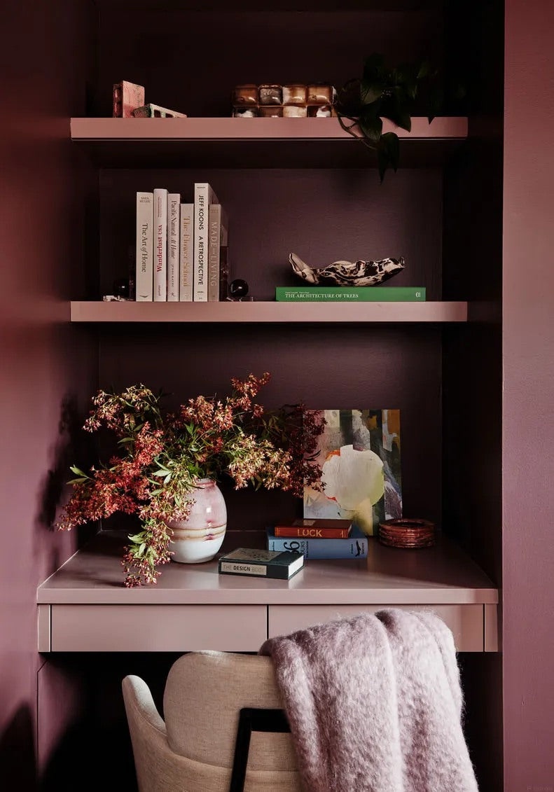 A color-washed shelf creates depth without visual clutter.