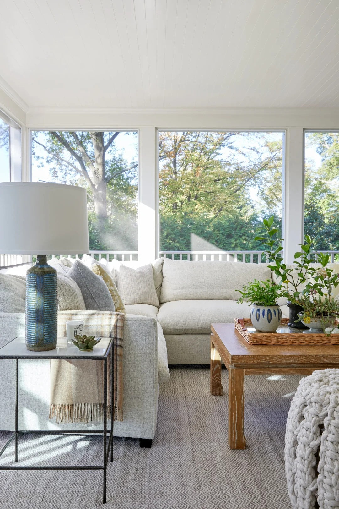 Window light and layered neutrals keep the room easygoing.