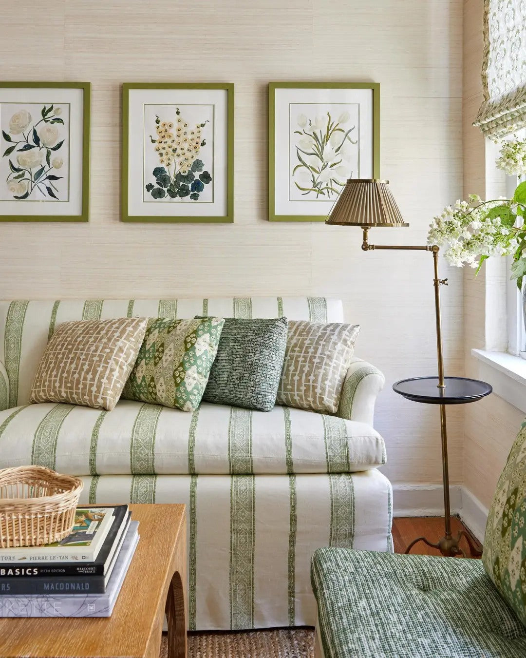 A striped sofa adds freshness without disrupting the quiet palette.