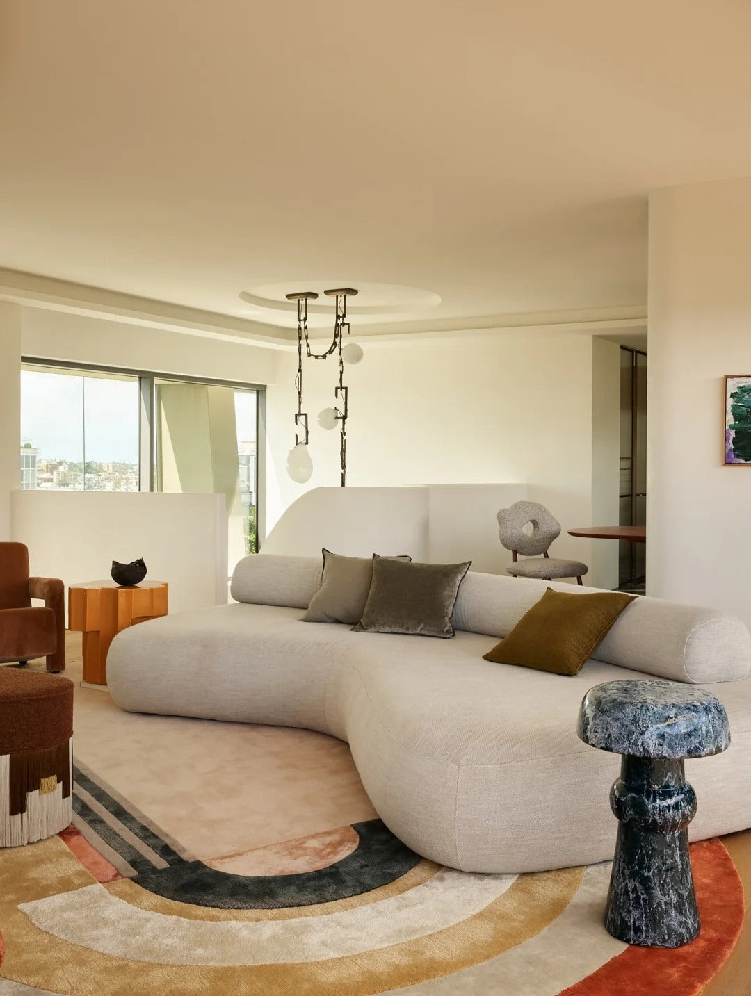 Curved seating softens a modern space and makes it feel more inviting.