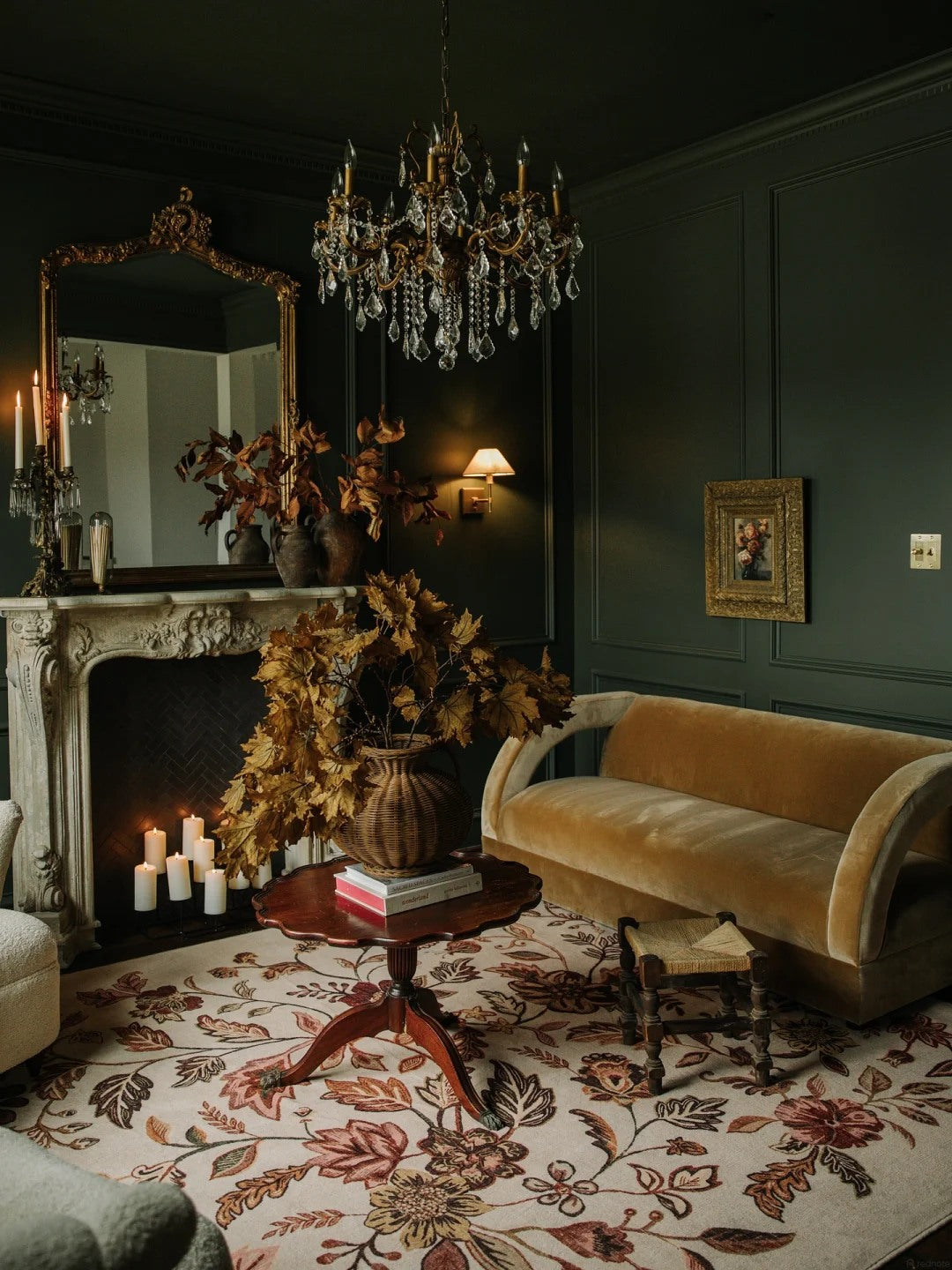 A moody wall color makes sculptural seating and lighting stand out.